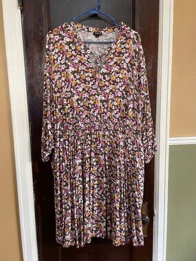 Floral tie-neck, shirred waist dress with three-quarter sleeves